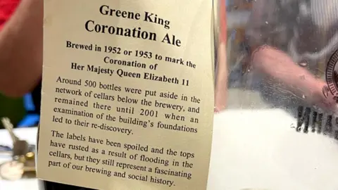 Doug Merlo The bottle neck tag from the coronation ale