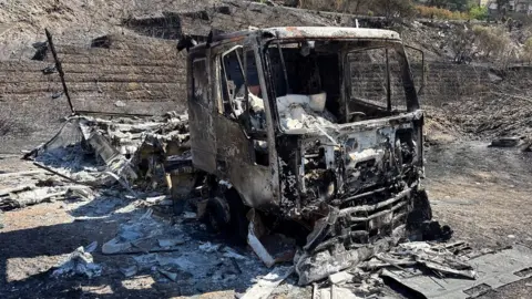BBC Burnt out vehicle