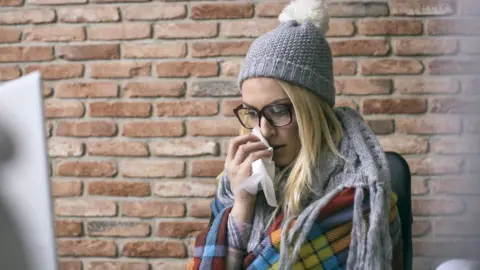 Getty Images cold office worker