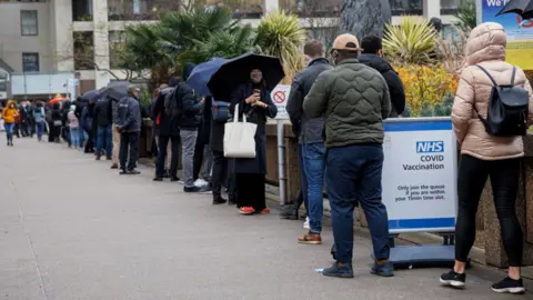 Getty Images Queue outside the vaccination centre at St Thomas' Hospital in London