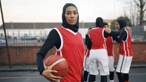 Asma Elbadawi and her basketball team in March 2018