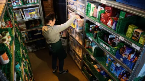 Getty Images Volunteer at foodbank run by Trussell Trust