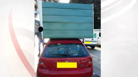 Devon and Cornwall Police shed on car roof