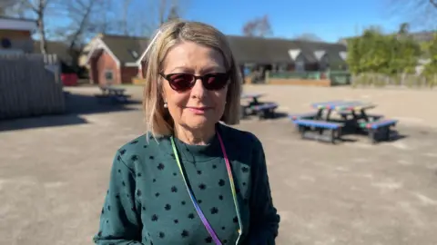 Shaun Whitmore/BBC Head teacher April Grimes stood in the playground