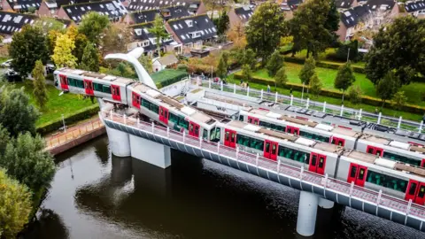 Getty Images Image shows a metro train that shot through a stop block at De Akkers metro station