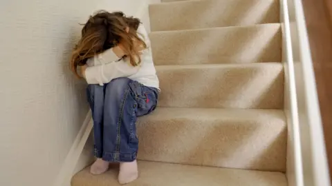 Girl sitting on stairs