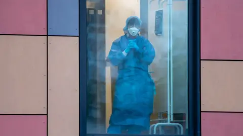 Getty Images Hospital worker in PPE during Covid