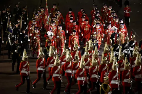 Henry Nicholls / Reuters Members of the military take part in a full overnight dress rehearsal of the Coronation Ceremony.