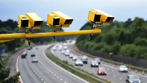 PA Media A row of speed cameras (stock image)