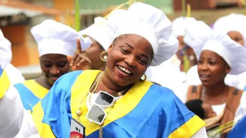 Members of the Celestial Church of Christ International headquarters observe a procession on Palm Sunday, in Lagos, Nigeria, 10 April 2022