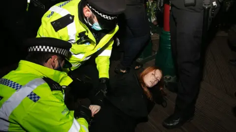 Getty Images Patsy Stevenson is arrested by police at Saturday's vigil for Sarah Everard