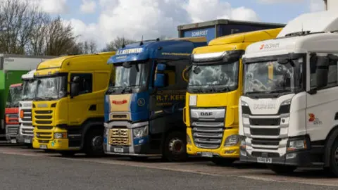 Getty Images Lorries at a motorway service station