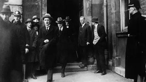 Getty Images Michael Collins arrives at Dublin Castle for the handover of power