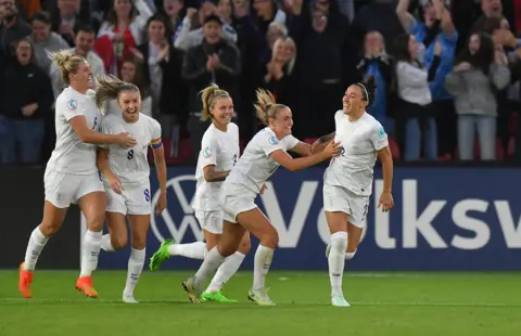 Getty Images The Lionesses celebrate as they beat Sweden 4-0 in the semi-final of the Euro 2022