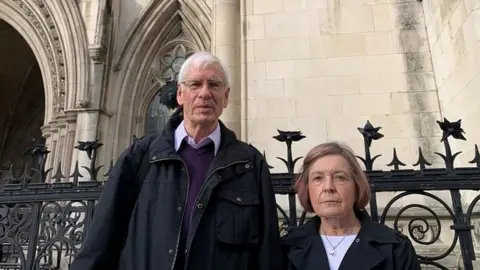 PA Media Sally Mays' parents at the High Court