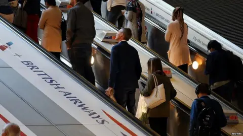 Reuters Commuters at a tube station in east London