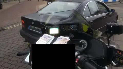 Norfolk and Suffolk Roads and Armed Policing Team The stopped BMW car