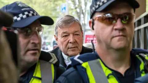 Reuters Cardinal George Pell walks towards his trial in Melbourne in 2017