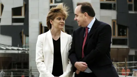 PA Media Alex Salmond celebrates with new deputy SNP leader Nicola Sturgeon after as he was declared winner of the Scottish National Party leadership campaign in Edinburgh.