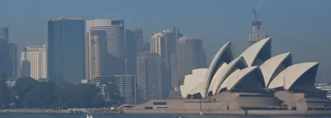 AFP/Getty Images Sydney Opera House and the city skyline seen through a layer of smoke