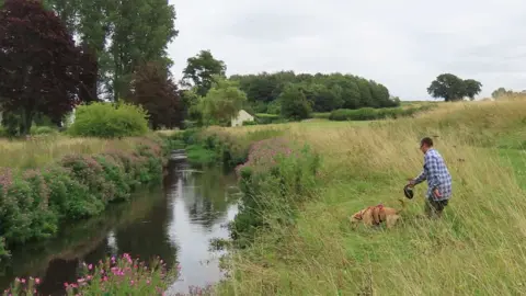 Vince Lea River and owner Stephen Mace searching for mink