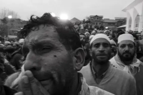 Azaan Shah People praying at Hazratbal shrine which is flanked by Dal Lake