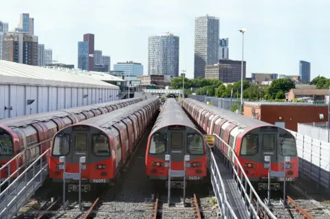 PA Media Jubilee line trains parked as workers joined members of the Rail, Maritime and Transport union in their strike in a dispute over pay, jobs and conditions