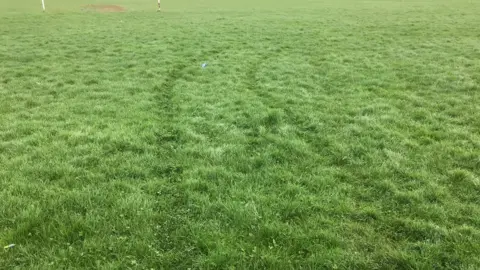 Tyre marks on the pitch