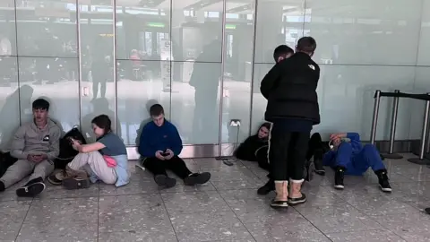 Prys Evans Part of the group from Llantrisant, South Wales, waiting around at Heathrow last week