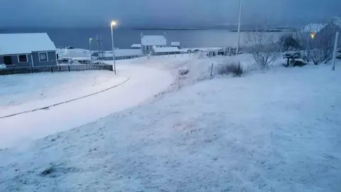 PA Media Snowfall in the Shetland Islands