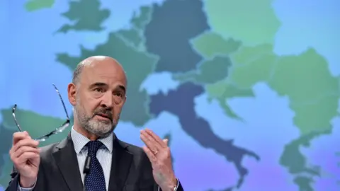 Getty Images European Commissioner for Economic and Financial Affairs, Taxation and Customs Pierre Moscovici gestures as he speaks during a press conference at the European Commission headquarters in Brussels on May 7, 2019.