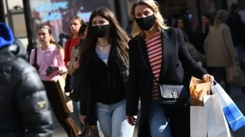 PA Media Shoppers wearing masks after lockdown easing
