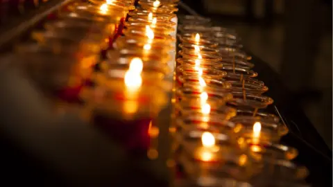 Getty Images Candles in Catholic Church