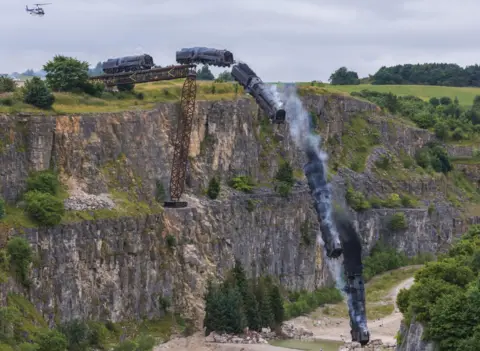 Alamy A train plunges down a ravine in North Yorkshire during filming for Mission: Impossible 7