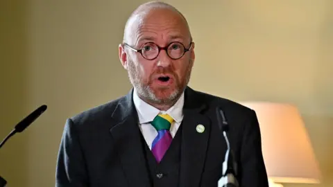 PA Media Patrick Harvie