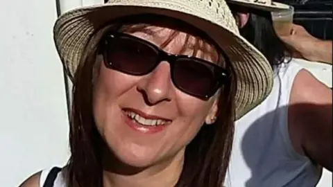 Family Handout Stacey Steer in a hat