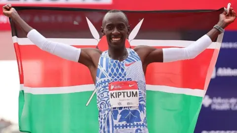 Getty Images Runner Kelvin Kiptum after breaking Eliud Kipchoge's marathon world record in Chicago