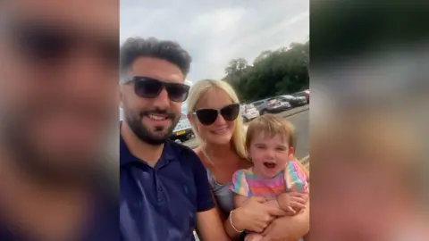 Owain James with wife, Ellie, and daughter