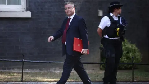 Reuters Sir Robert Buckland walking outside No.10 Downing Street