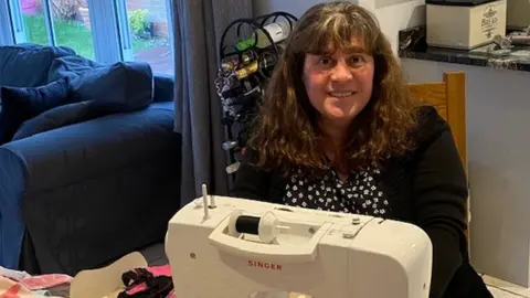 Ruth Smith Ruth Smith at a sewing machine