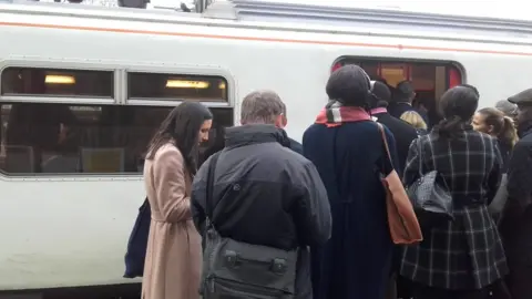 Maria Compadre Passengers get onto an Greater Anglia service train