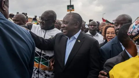 MICHELE SPATARI President Cyril Ramaphosa arrives to cast his vote at a primary school in Soweto on May 8