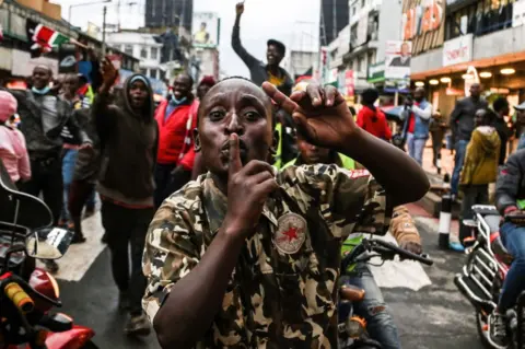 Getty Images People celebrating on the streets.