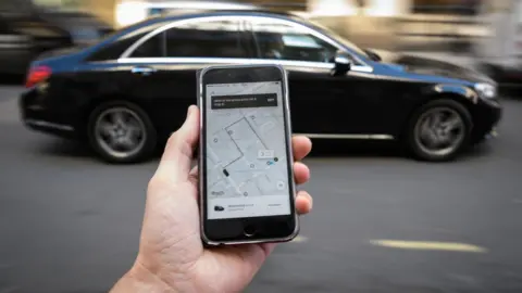Man using Uber app