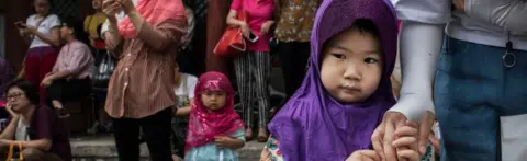 Getty Images Chinese Hui Muslims gather before Eid al-Fitr prayers