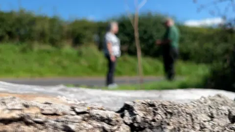 Blurry photo of man and woman in a lane
