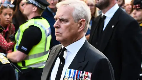 Getty Images Prince Andrew walking behind hearse