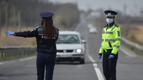 AFP A Romanian police checkpoint near Tandarei, 4 Apr 20