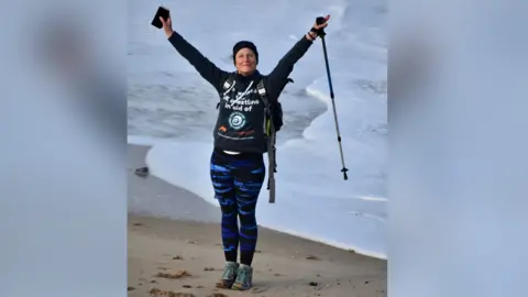 Blue Wilson Blue Wilson standing on a beach