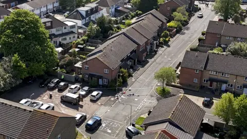 PA Media An aerial view of a police cordon at the scene